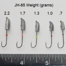 The five weights of JH-85 jig heads. Left to right, 2.2g, 1.7g, 1.3g, 1g, and .7g. Ruler along the bottom showing width of the hook gapes.