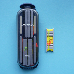Daiwa 1500SK Keiryu Line Holder, with nine of it's small line winders inside the plastic case, and one outside the case.
