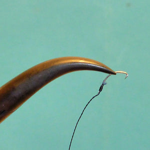 Dr. Slick Spring Creek Clamps - close-up of very fine pointed jaws holding a Gamakatsu Ultimate tanago hook.